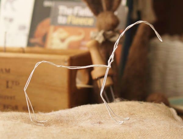 Image shows a needle felting wire armature/frame ready to make a needle felted fox.
