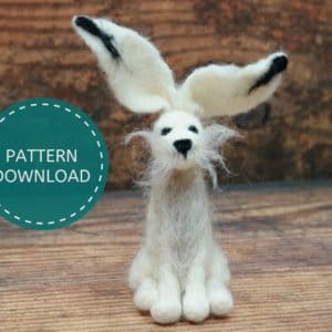 Needle felted hare against a dark wood backdrop. text says, pattern download