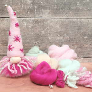 A cute pink needle felted gnome that you can easily make yourself.