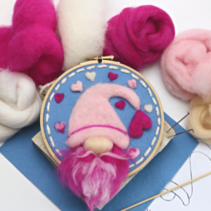 Needle felted gnome in a hoop needle felting kit. Lovely bright pink wool, embroidery hoop.