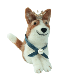 Image shows a cute needle felted corgi wearing a gold sparkly crown, royal blue sash and pearl