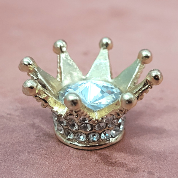 Image shows a miniature gold and crystal crown for dolls and needle felting projects