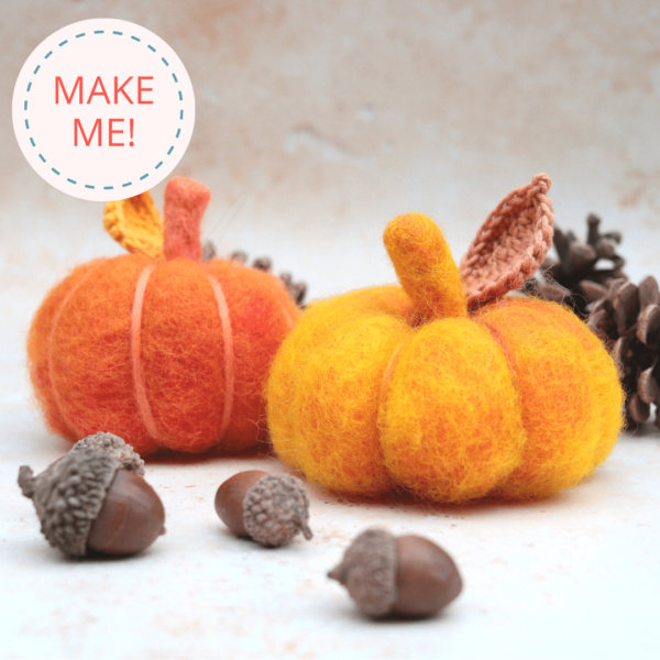 Image shows handmade needle felted pumpkin that can be made from a needle felting kit. Blurred background of autumn and fall decorations. Text reads: Make Me!